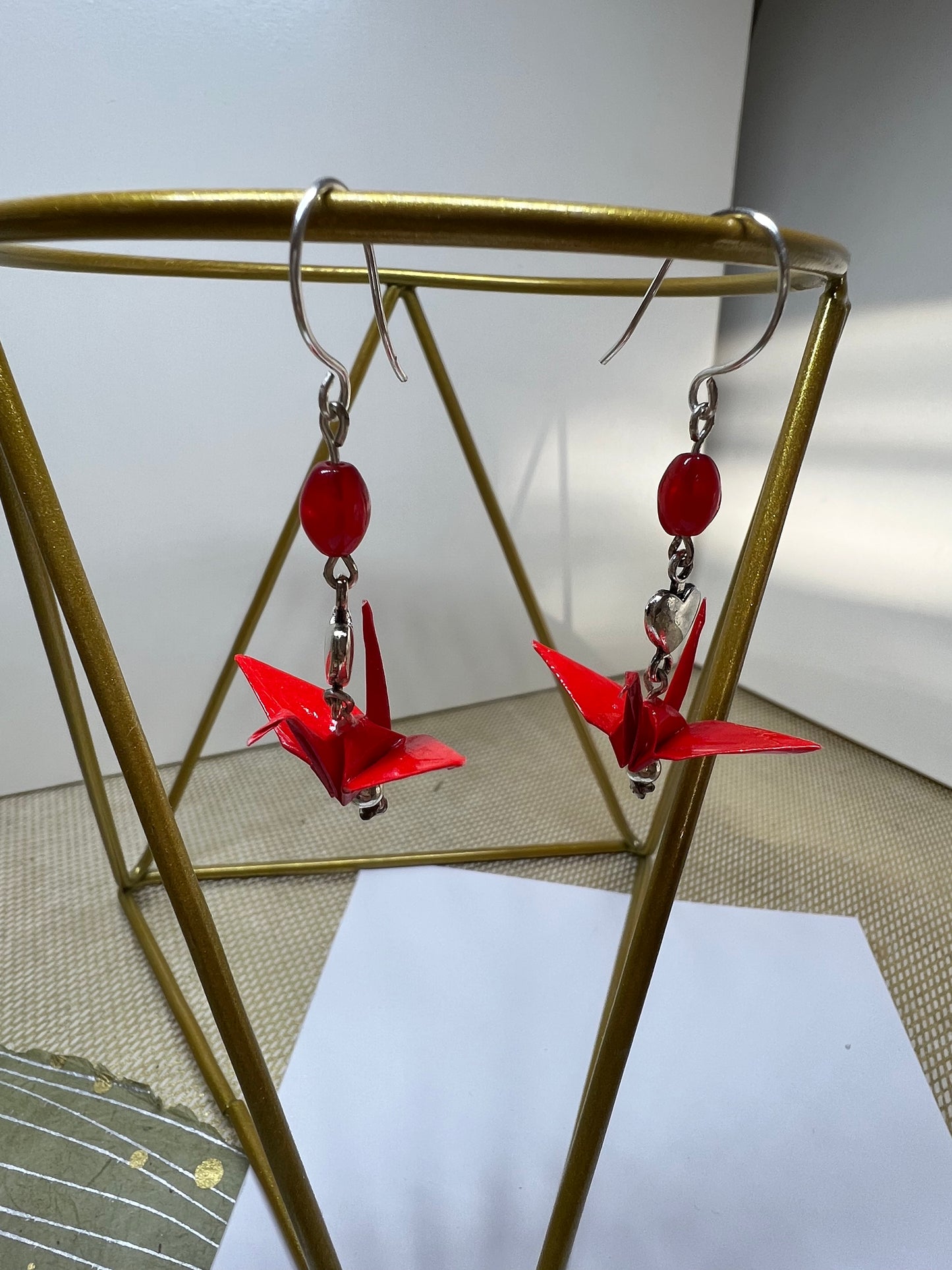 Origami red crane with heart & red beads